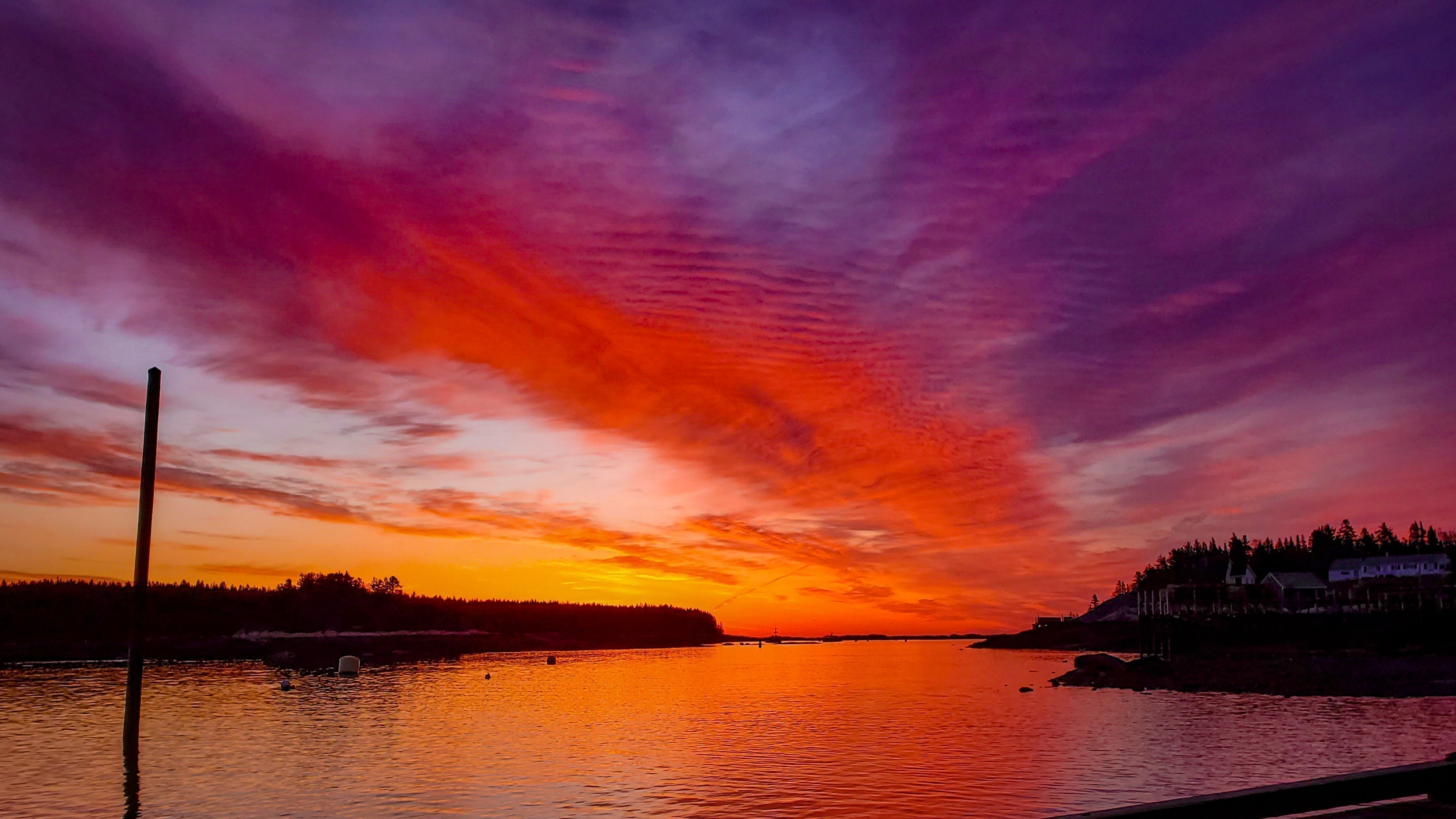 Sunset on from a harbor on the Maine coast.