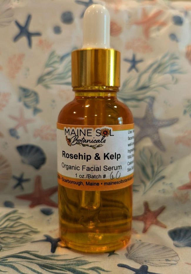 Facial serum bottle labeled 'Maine Sol Botanicals' on a patterned background