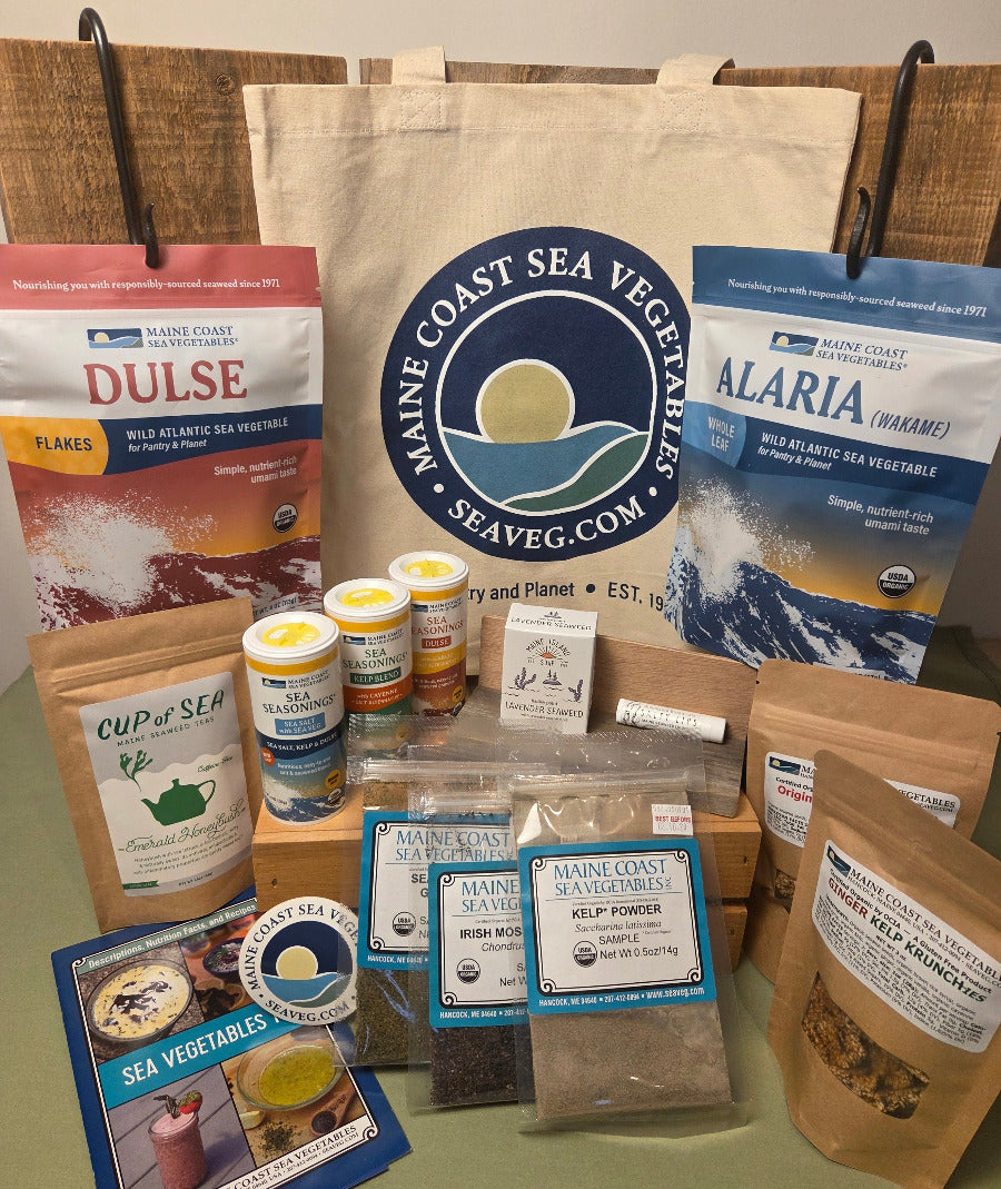 Collection of Maine Coast Sea Vegetables products including whole leaf seaweeds, Sea Seasoning shakers, Kelp Krunch bags, sticker, soap, tea, and lip balm.